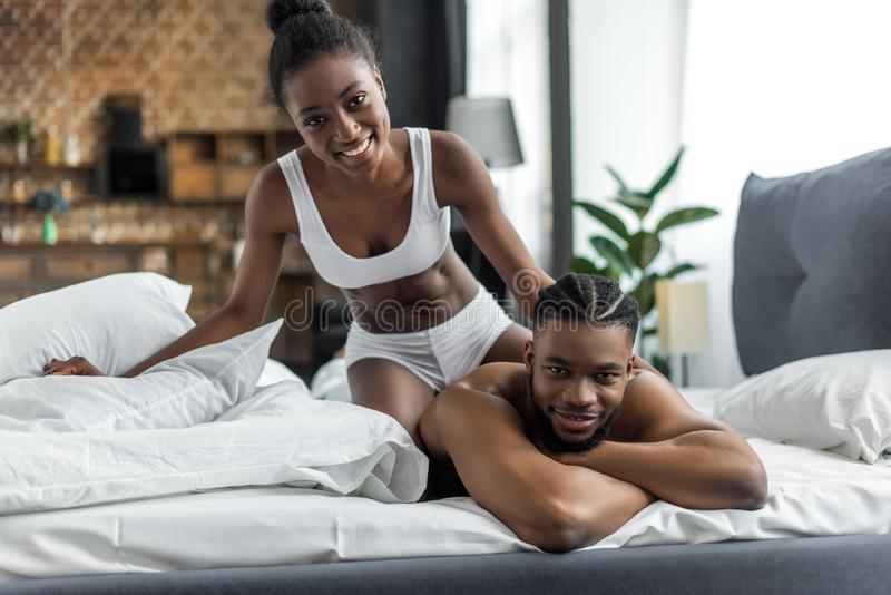 smiling african american couple underwear looking camera bedroom smiling african american couple underwear looking 127719099